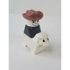 Vintage Lego Duplo Figure Cowboy on top of Vintage Lego Duplo Sheep